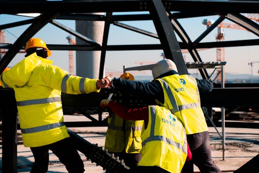 construction site with workers in safety gear