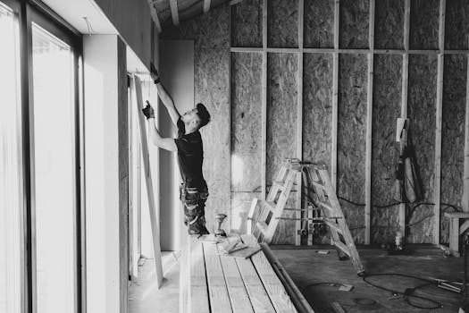 construction worker installing guardrails