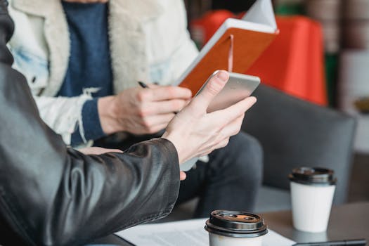 Image of a contractor using a tablet to show clients their project designs