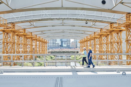 construction site with workers wearing masks