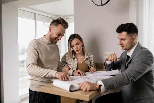 contractor reviewing plans with a client