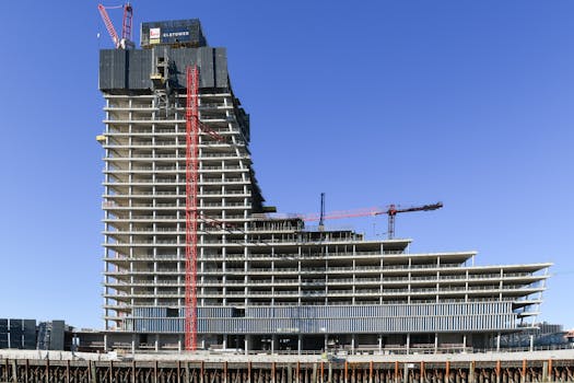 construction site with cranes and workers